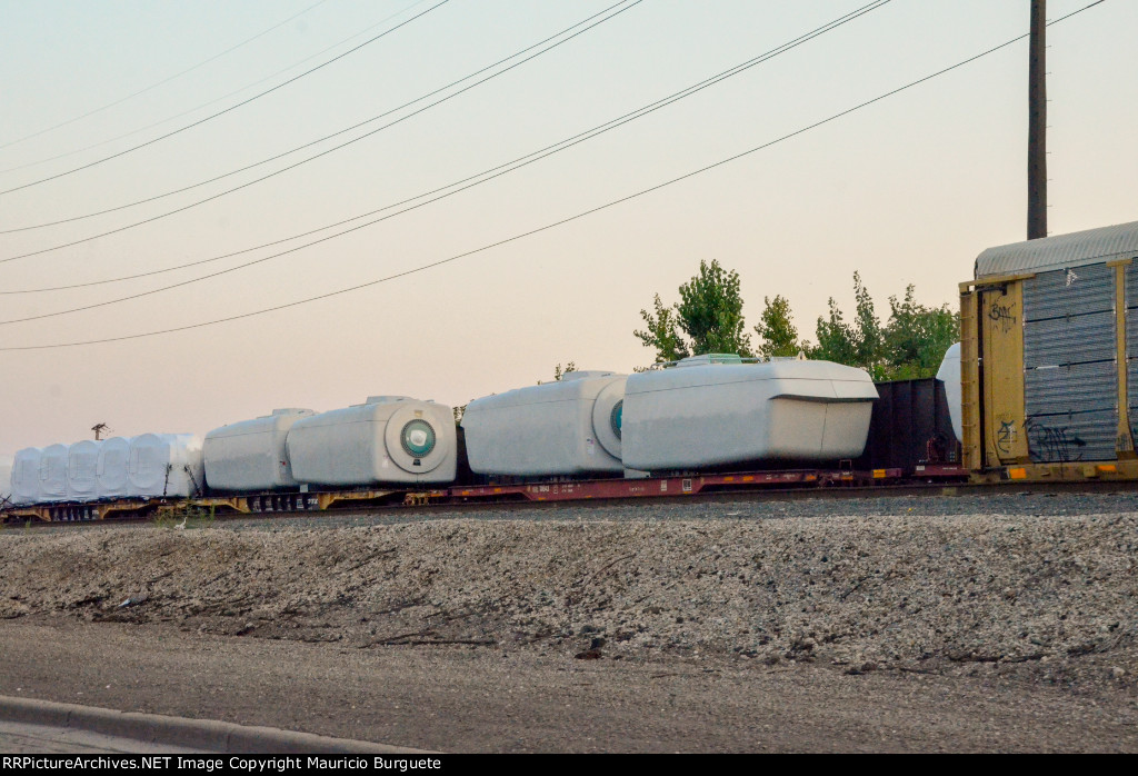 QTTX & KRL Flat cars with load in the yard